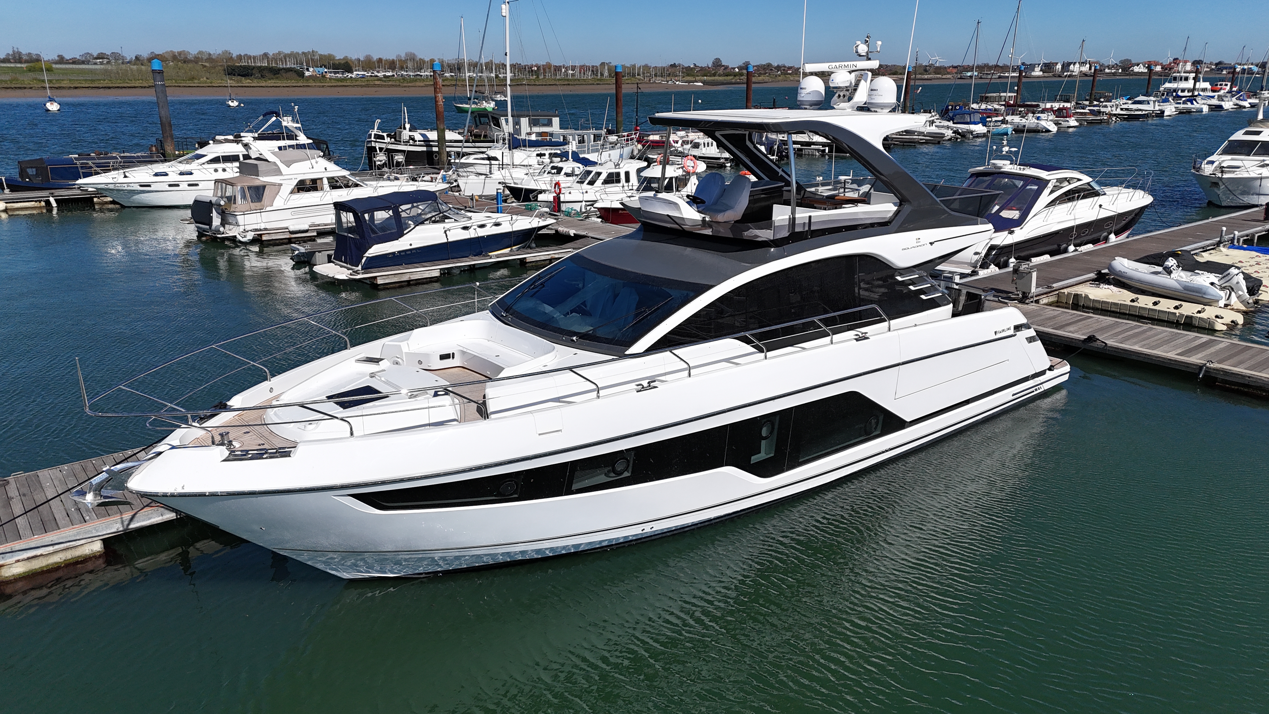 Fairline Squadron 58 yacht docked at a marina.